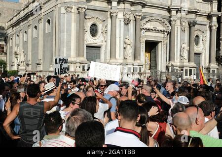 Catania, Sicily, July 24, `NoVax` and `NoGreenPass` or Anti health pass manifestation in the city center. Thousands of anti-lockdown and anti-vaccine protesters gathered in central Catania on 2021. Stock Photo
